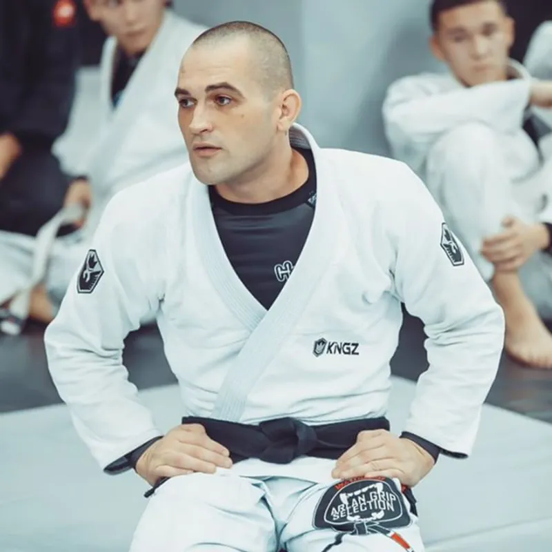 Adam Fox in gi with students